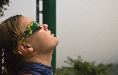 Woman watching Solar Eclipse in China, July 22nd 2009.