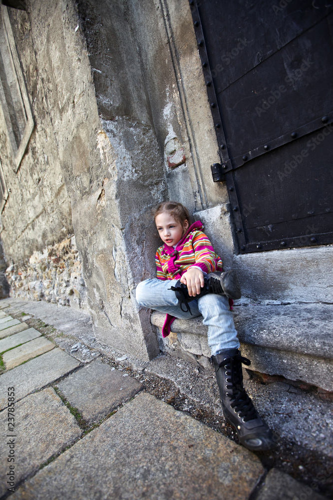 cute girl sitting on old steps of old building cute girl sitting on old steps of old building