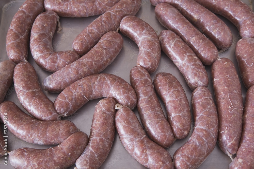 Uncooked Sausage On A Baking Sheet Uncooked Sausage On A Baking Sheet
