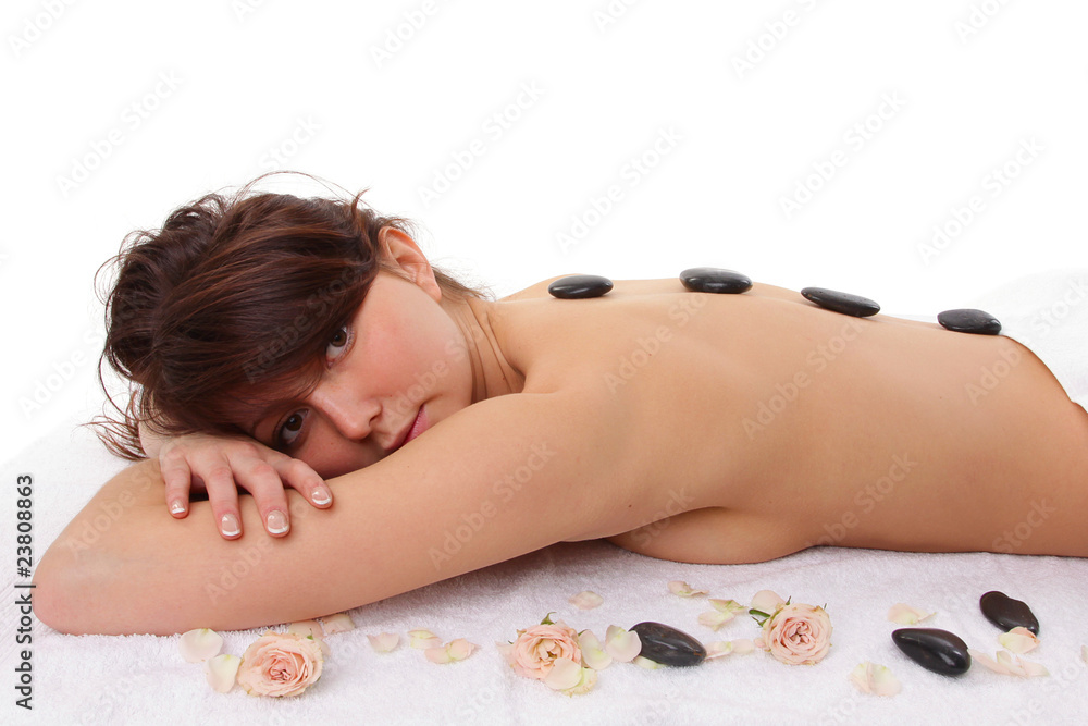 Attractive woman getting spa treatment isolated on white Attractive woman getting spa treatment isolated on white