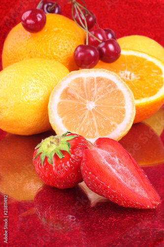 Fototapeta Naklejka Na Ścianę i Meble -  Colorful fresh fruits assortment on red