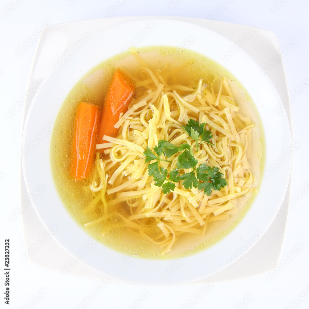 Chicken soup with macaroni and carrots decorated with parsley Chicken soup with macaroni and carrots decorated with parsley