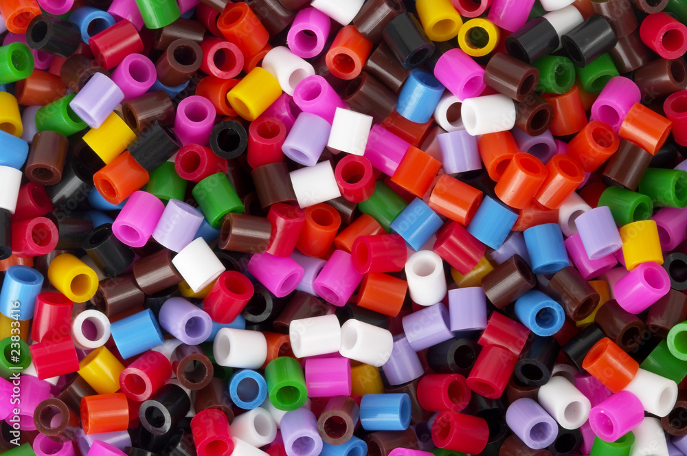 Colored plastic pieces background Colored plastic pieces background