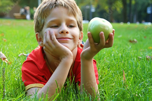 Boy with an green apple