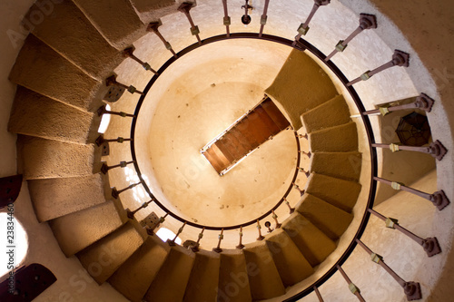 Round old staircase going up photo