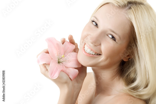 Beautiful woman with pink lily smile isolated on white