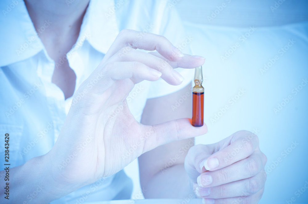 ampoule in hand ampoule in hand