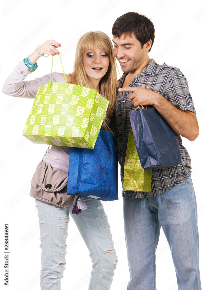 Beautiful young couple with shopping bags