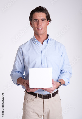 Young man holding your product