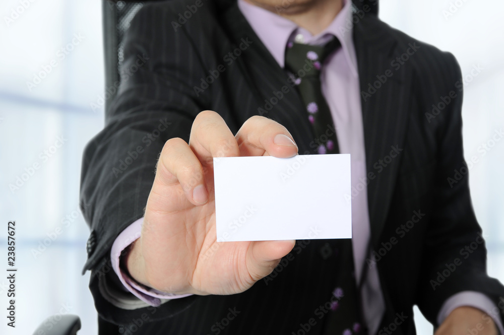 Business man handing a blank card Business man handing a blank card