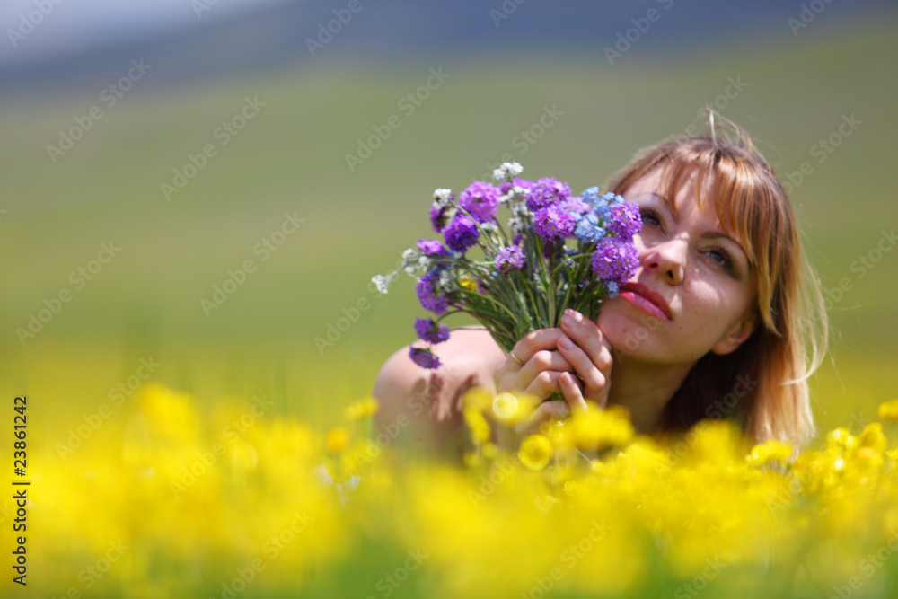 Fototapeta premium The girl with a bunch of flowers