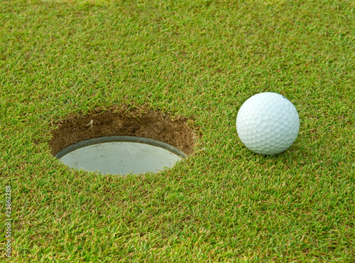 Golf ball near the hole