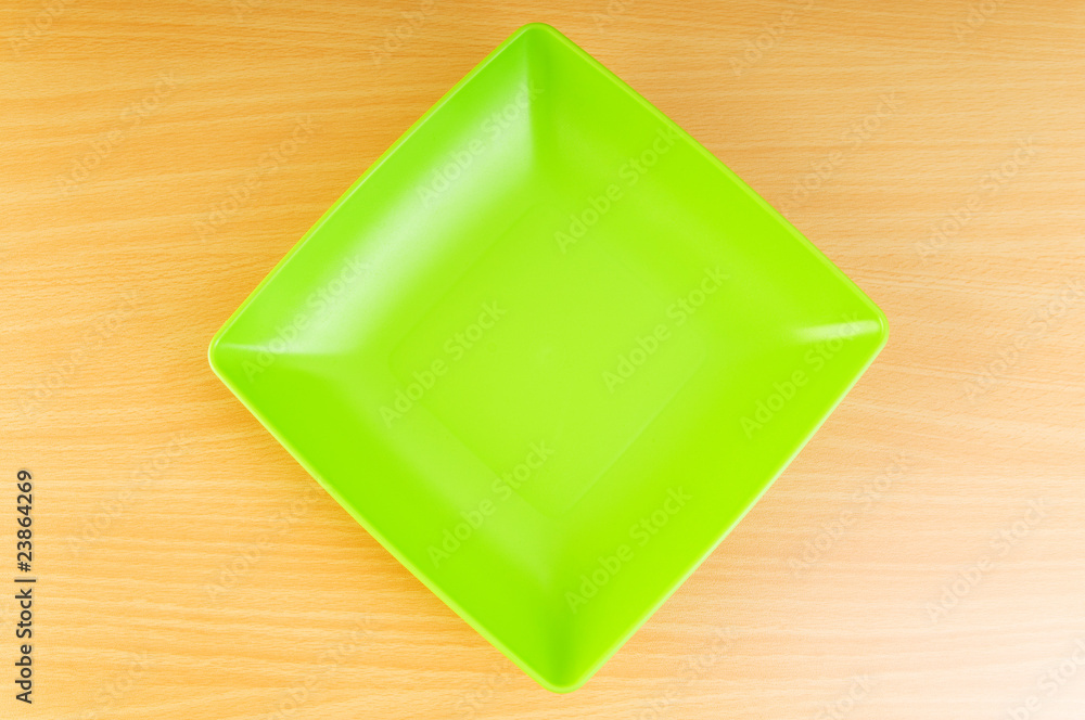Empty plate on the wooden table Empty plate on the wooden table