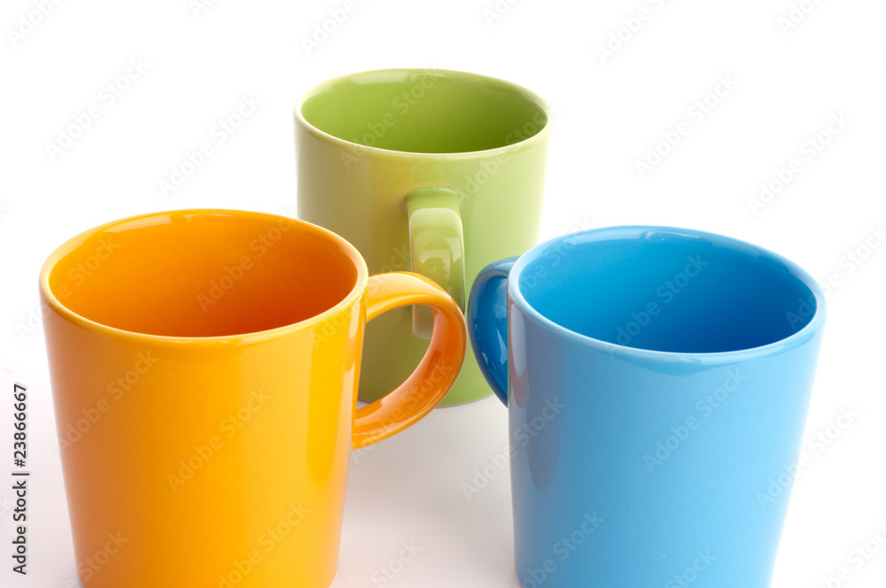 Colored cups. Isolated on white background. Colored cups. Isolated on white background.