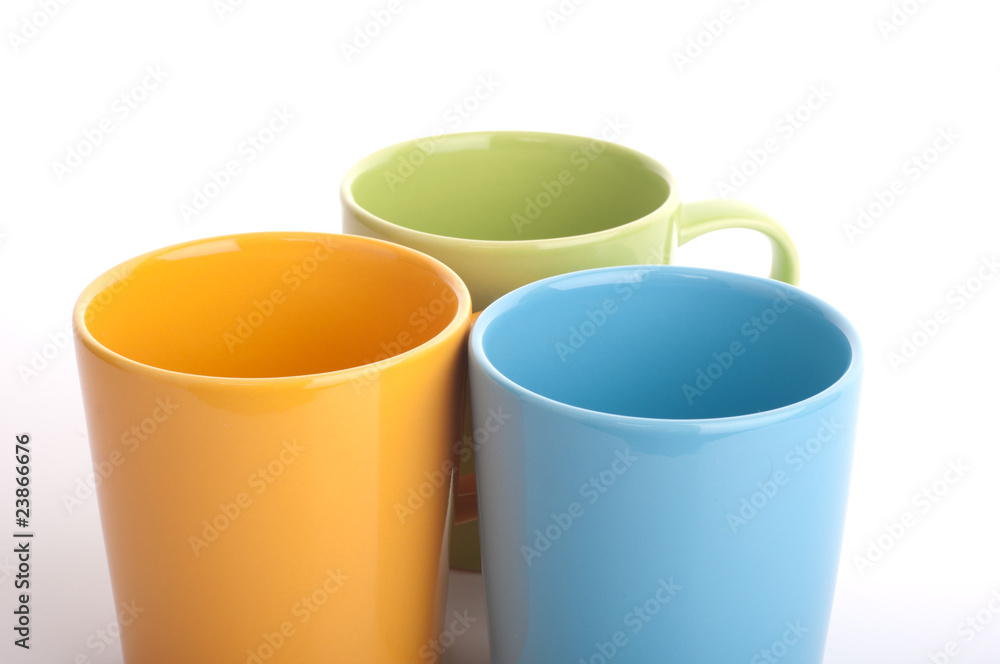 Colored cups. Isolated on white background. Colored cups. Isolated on white background.