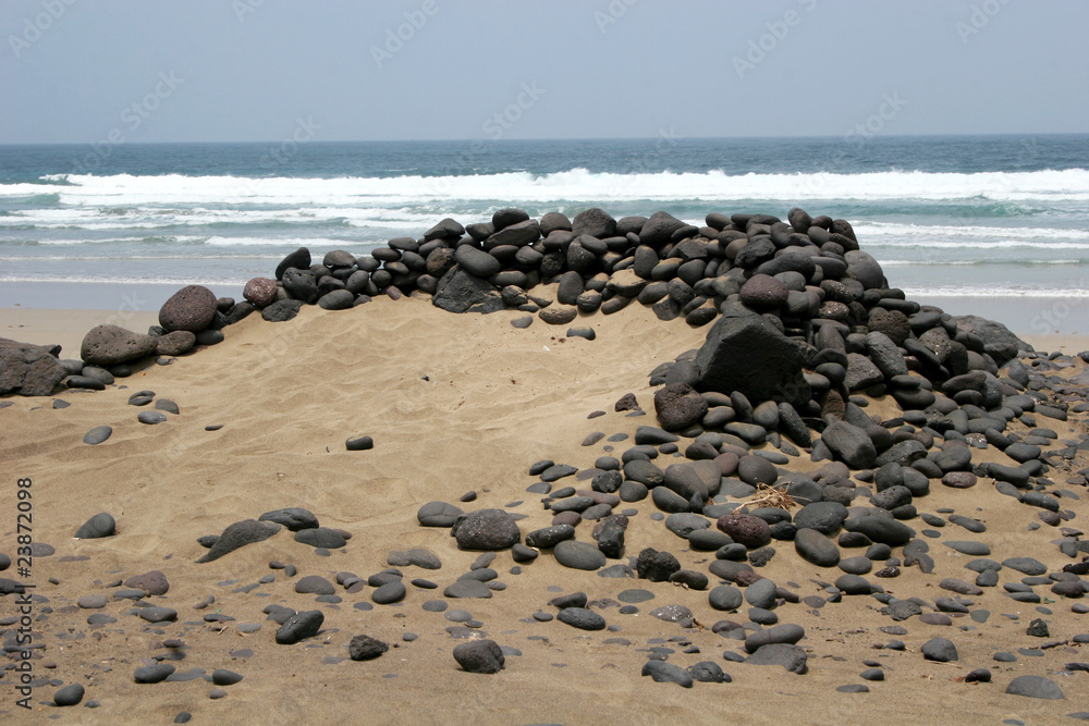 stone shelter on beach