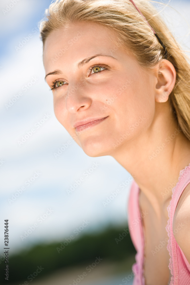 Portrait of smiling blond woman enjoy sunny day Portrait of smiling blond woman enjoy sunny day