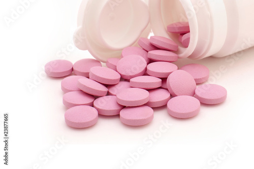 Vial and some pink tablets