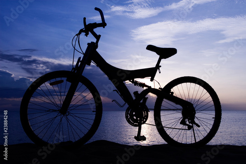 Fototapeta Naklejka Na Ścianę i Meble -  Silhouette of a Bike on the Beach