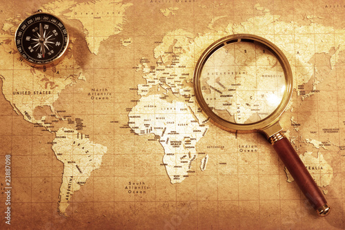 compass on a Treasure map background ,with Magnifier
