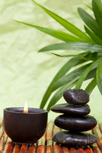 Balanced pebbles and aromatherapy candle