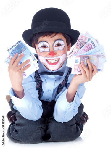 happy child clown showing both hands full of money © Lucky Dragon USA