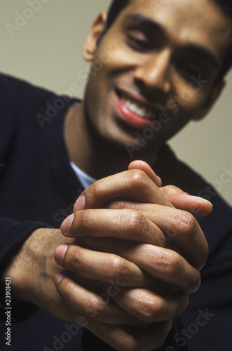 Man Looks Down At Hands