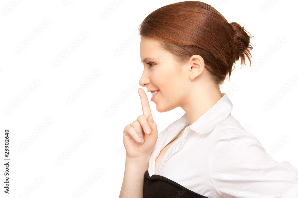 bright picture of teenage girl with finger on lips bright picture of teenage girl with finger on lips
