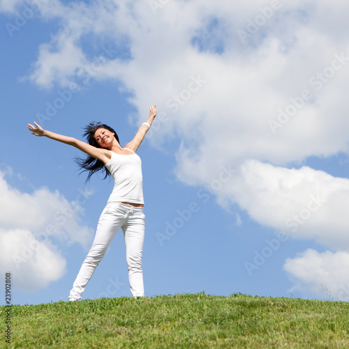 happy young woman dreams to fly on winds