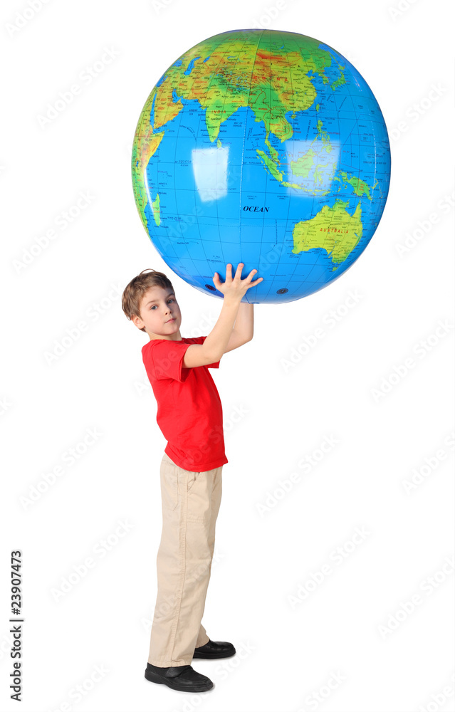 boy in red shirt holding big inflatable globe over his head boy in red shirt holding big inflatable globe over his head