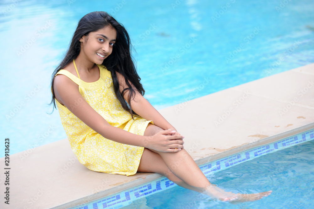girl sitting at pool