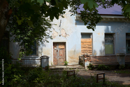 Photo of enterance of old decrepit house © Michael Nechaev
