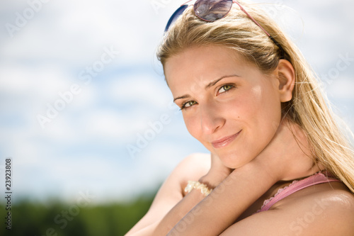 Portrait of blond woman with summer sky © CandyBox Images