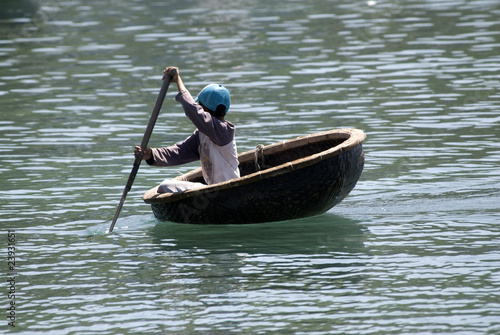 Vietnamese fisherman and his boat