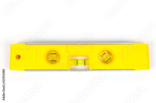 Yellow spirit level isolated on a white background