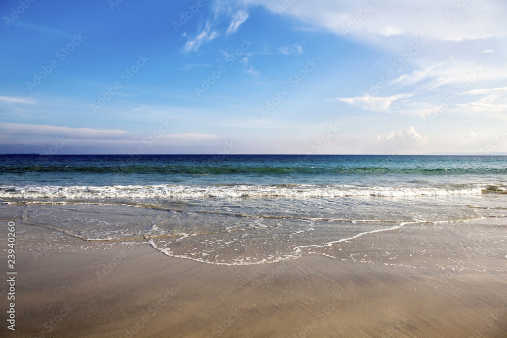 Waves lapping on the beach.