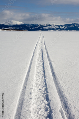 Skidoo track on frozen lake