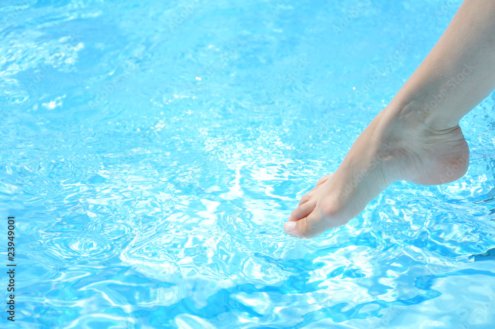 Female leg at the swimming pool