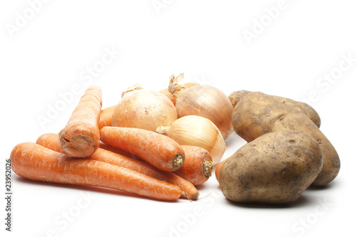 heap of carrots onions and potatoes