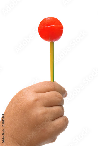 lollipop in the hand of a child