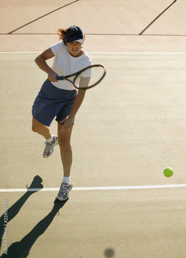 Woman Plays Tennis