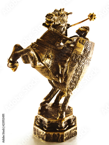 The old carved figure of a chess knight.