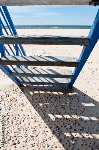 Blue beach stairs. Leading to the seaside.