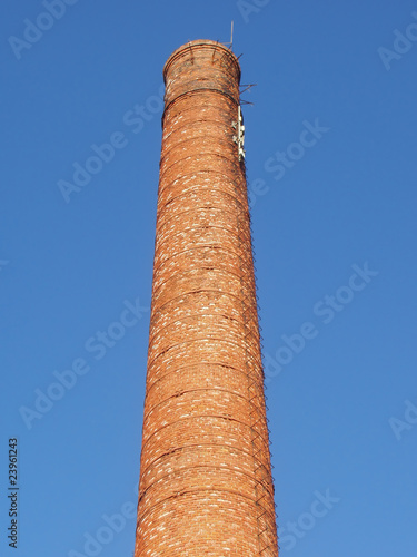 Tall industrial factory chimney.