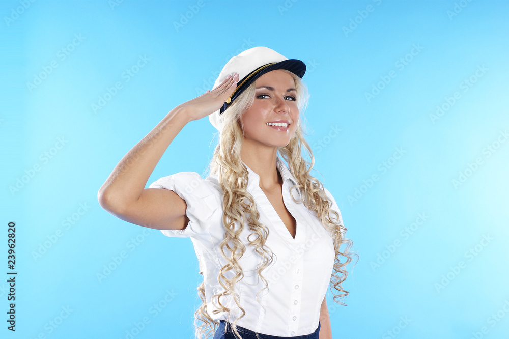 Young attractive blond smiling sailor lady saluting Young attractive blond smiling sailor lady saluting