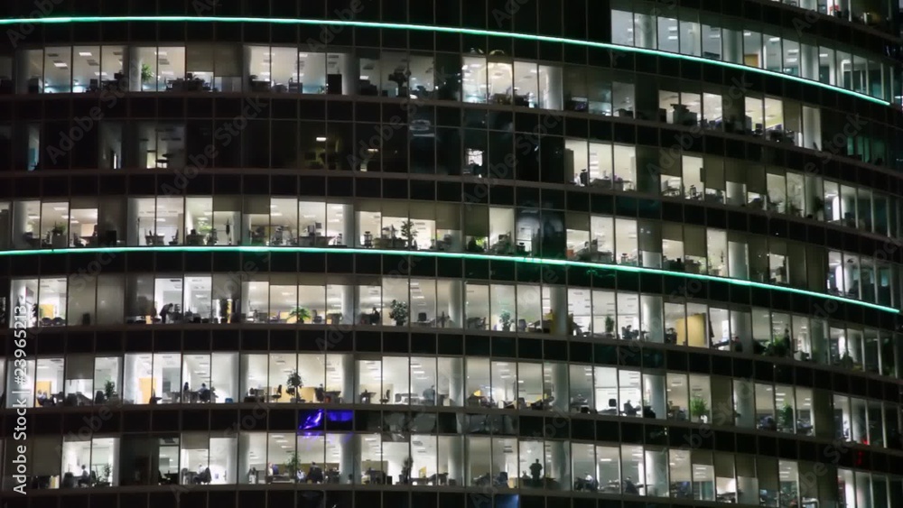 building at night decorated with strips changing colour building at night decorated with strips changing colour