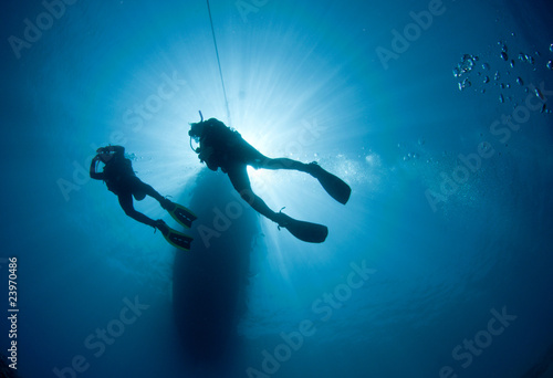 Scuba Diver silhouetted against the sun