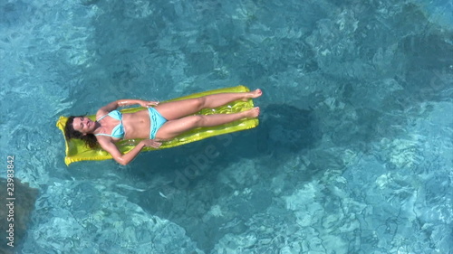 swimming out inflatable mattress with woman in water pool