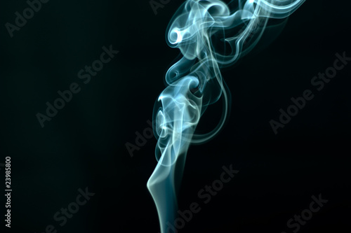 Stream of a blue smoke on a black background