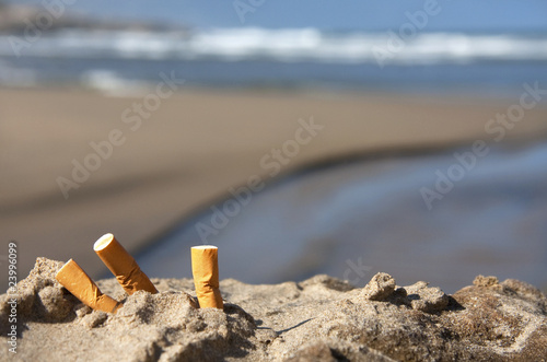 three cigarette butts on beach